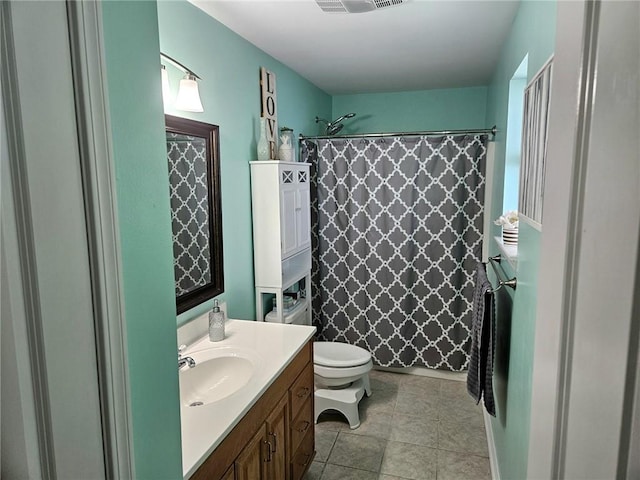 bathroom with vanity, a shower with curtain, visible vents, toilet, and tile patterned floors