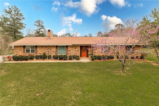 59345 Twin Pines Rd, Bogalusa, LA 70427 - ranch-style house featuring a chimney, a front lawn, and brick siding