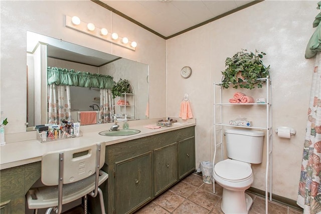 59345 Twin Pines Rd, Bogalusa, LA 70427 - bathroom featuring toilet, vanity, and ornamental molding