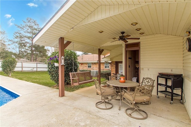 59345 Twin Pines Rd, Bogalusa, LA 70427 - view of patio with fence, outdoor dining space, ceiling fan, and a fenced in pool