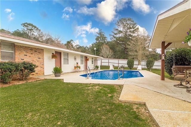 59345 Twin Pines Rd, Bogalusa, LA 70427 - view of swimming pool featuring a lawn, a fenced in pool, a fenced backyard, and a patio area
