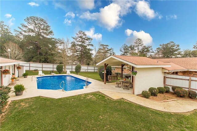 59345 Twin Pines Rd, Bogalusa, LA 70427 - view of swimming pool with a patio, a fenced in pool, a fenced backyard, and a yard