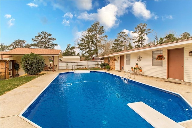 59345 Twin Pines Rd, Bogalusa, LA 70427 - view of swimming pool featuring a patio, fence, a fenced in pool, and a diving board