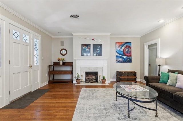 1338 Fern St, New Orleans, LA 70118 - living room featuring wood finished floors, ornamental molding, baseboards, and a high end fireplace