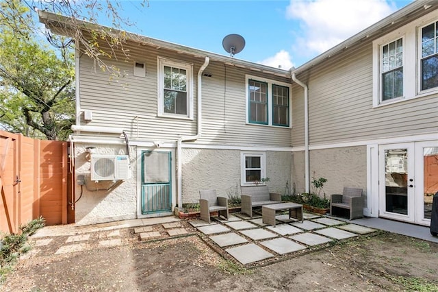 1338 Fern St, New Orleans, LA 70118 - back of house featuring a patio, fence, a cooling unit, a gate, and stucco siding