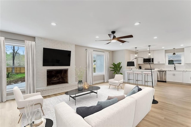 156 Belle Terre Blvd, Covington, LA 70433 - living area with plenty of natural light, light wood-type flooring, ceiling fan, recessed lighting, and a fireplace