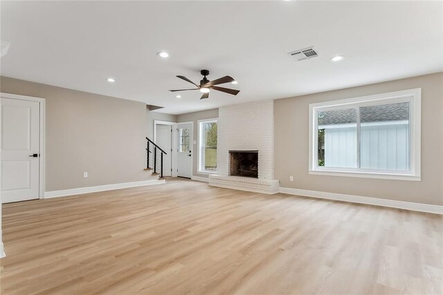 156 Belle Terre Blvd, Covington, LA 70433 - unfurnished living room featuring stairway, light wood finished floors, a fireplace, recessed lighting, and ceiling fan