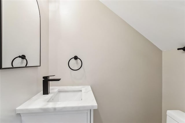 156 Belle Terre Blvd, Covington, LA 70433 - half bath with lofted ceiling, toilet, and vanity