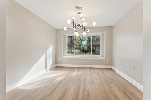 156 Belle Terre Blvd, Covington, LA 70433 - unfurnished dining area with light wood-style flooring, a chandelier, and baseboards