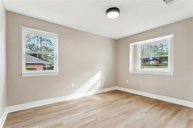 156 Belle Terre Blvd, Covington, LA 70433 - spare room with plenty of natural light, baseboards, and light wood-style floors