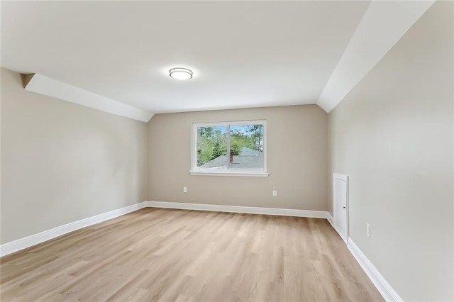 156 Belle Terre Blvd, Covington, LA 70433 - spare room featuring light wood finished floors, lofted ceiling, and baseboards