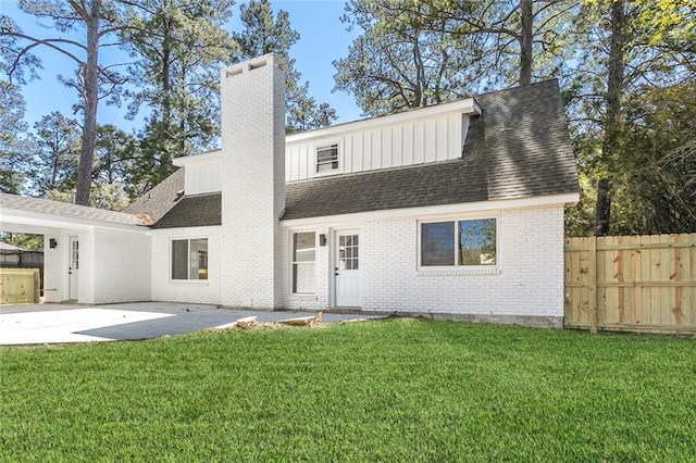 156 Belle Terre Blvd, Covington, LA 70433 - rear view of property featuring a chimney, brick siding, roof with shingles, a patio area, and board and batten siding