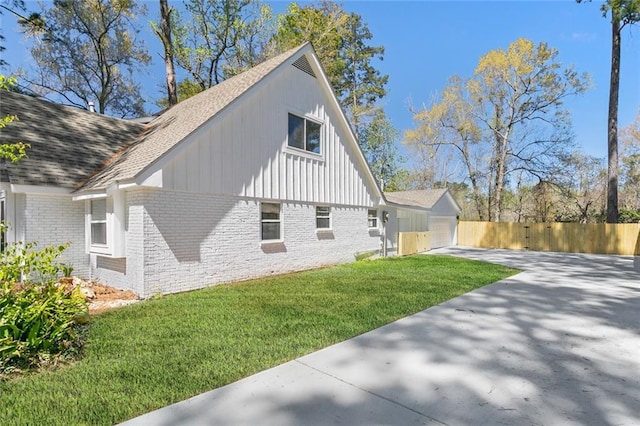 156 Belle Terre Blvd, Covington, LA 70433 - view of home's exterior with brick siding, roof with shingles, driveway, and board and batten siding