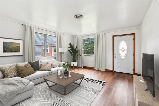 1029 Terry St, New Orleans, LA 70114 - living area with baseboards, visible vents, and wood finished floors