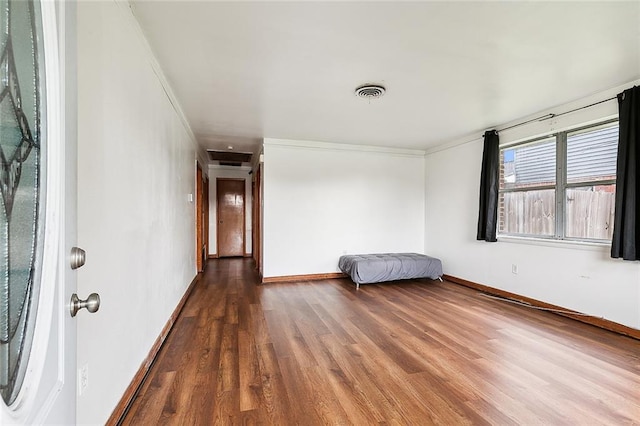 1029 Terry St, New Orleans, LA 70114 - unfurnished room with visible vents, ornamental molding, baseboards, and wood finished floors