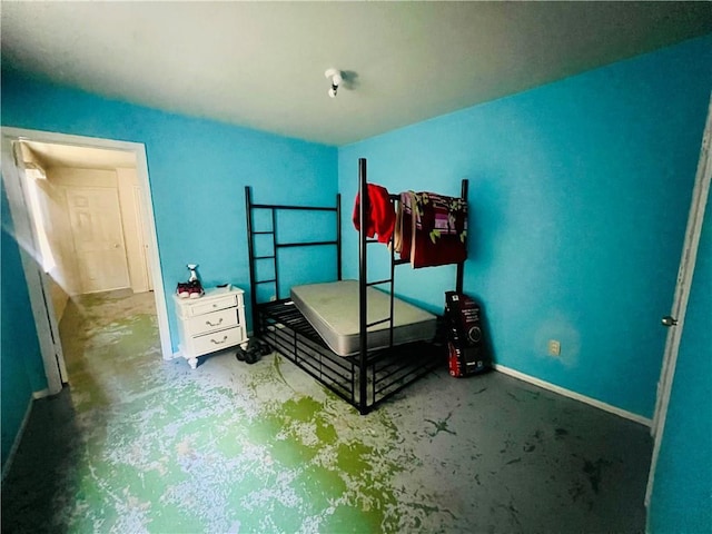 412729 Hollygrove St, New Orleans, LA 70118 - bedroom with concrete flooring and baseboards