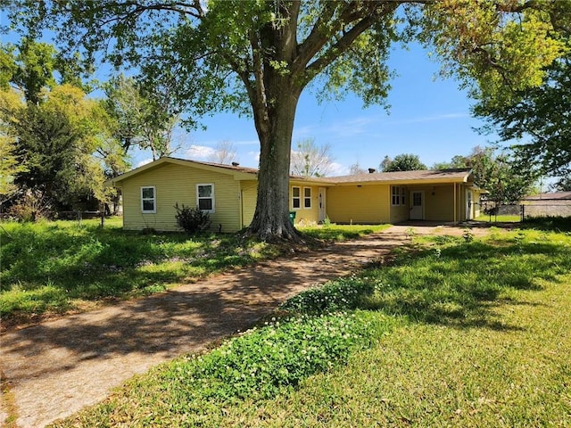 167 Celia Dr, Luling, LA 70070 - rear view of property with a lawn, an attached carport, and fence