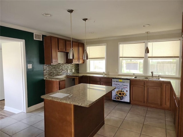 167 Celia Dr, Luling, LA 70070 - kitchen featuring a sink, brown cabinetry, crown molding, and dishwasher