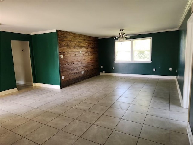 167 Celia Dr, Luling, LA 70070 - spare room featuring baseboards, wooden walls, ornamental molding, and a ceiling fan
