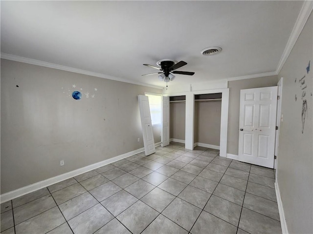 167 Celia Dr, Luling, LA 70070 - unfurnished bedroom featuring multiple closets, visible vents, baseboards, ornamental molding, and a ceiling fan