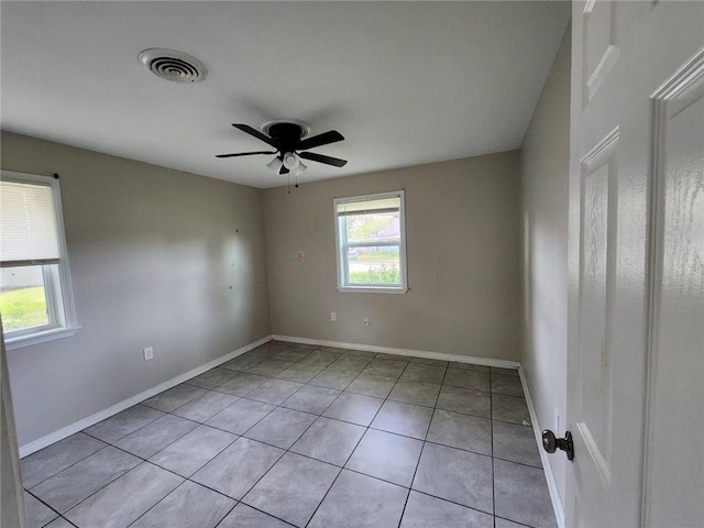 167 Celia Dr, Luling, LA 70070 - spare room featuring light tile patterned flooring, baseboards, visible vents, and a ceiling fan