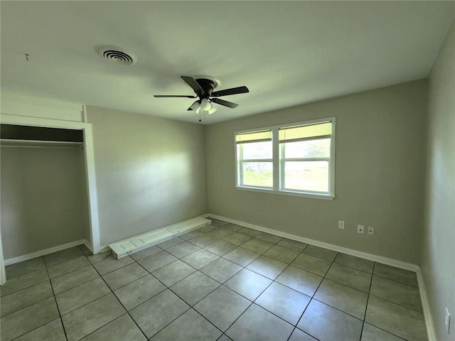 167 Celia Dr, Luling, LA 70070 - unfurnished bedroom with tile patterned floors, baseboards, a closet, and visible vents
