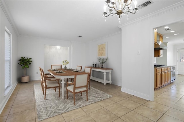 4232 Connecticut Ave, Kenner, LA 70065 - dining space featuring light tile patterned flooring, a chandelier, ornamental molding, and baseboards