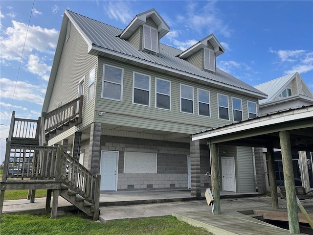 100 Deer Range Ln, Port Sulphur, LA 70083 - exterior space with stairway and metal roof