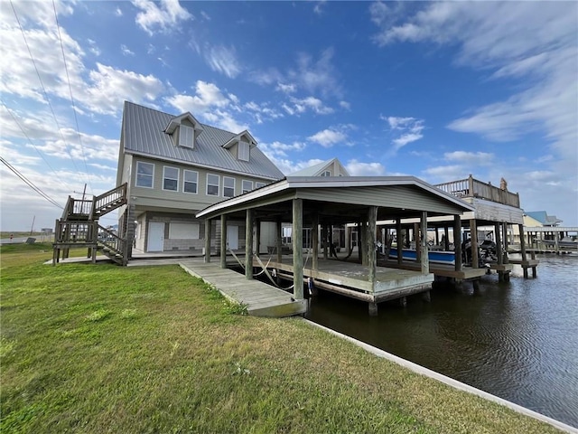 100 Deer Range Ln, Port Sulphur, LA 70083 - view of dock featuring a lawn, boat lift, a water view, and stairway