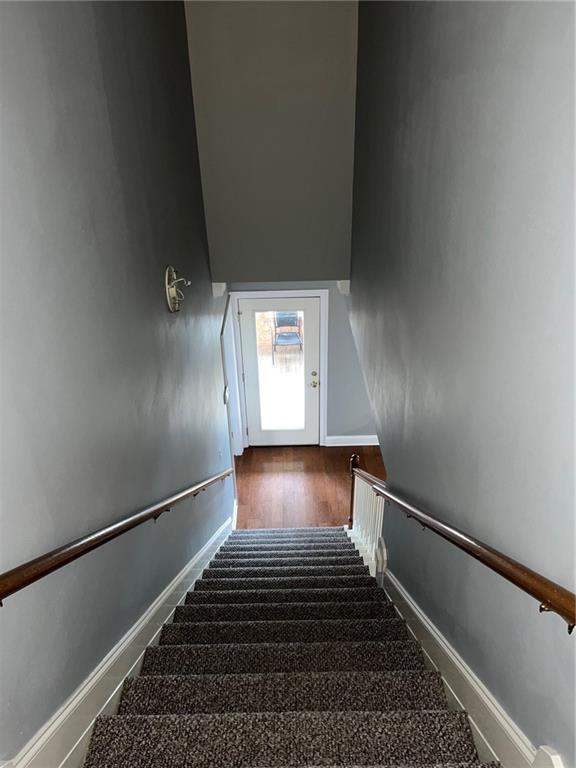 100 Deer Range Ln, Port Sulphur, LA 70083 - staircase featuring baseboards and wood finished floors