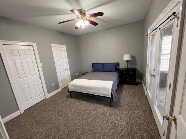 100 Deer Range Ln, Port Sulphur, LA 70083 - bedroom featuring a ceiling fan, baseboards, and dark carpet