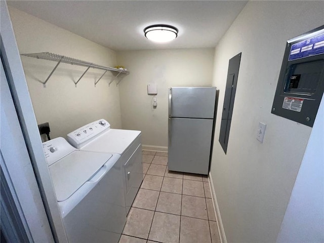 100 Deer Range Ln, Port Sulphur, LA 70083 - washroom featuring laundry area, light tile patterned flooring, baseboards, electric panel, and independent washer and dryer