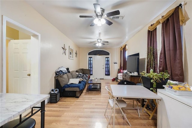 1983 Law St, New Orleans, LA 70119 - living area featuring light wood finished floors, ceiling fan, and visible vents