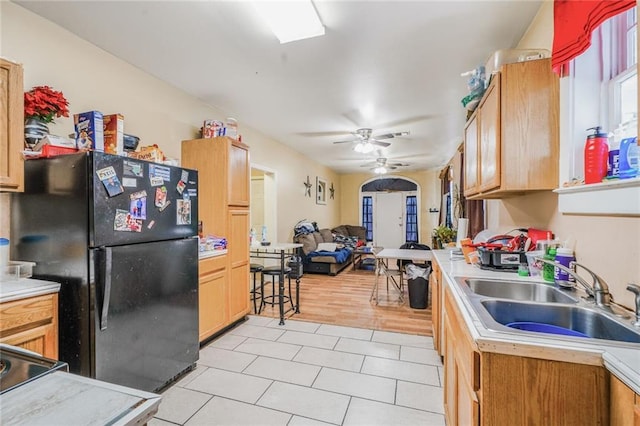 1983 Law St, New Orleans, LA 70119 - kitchen with freestanding refrigerator, light countertops, a sink, and open floor plan