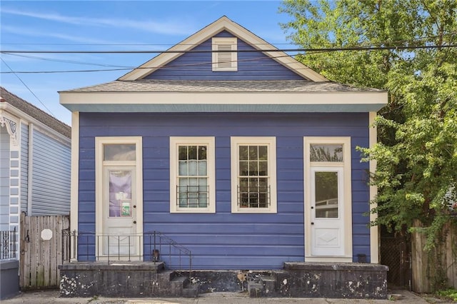 133234 Port St, New Orleans, LA 70117 - view of front facade with fence and roof with shingles