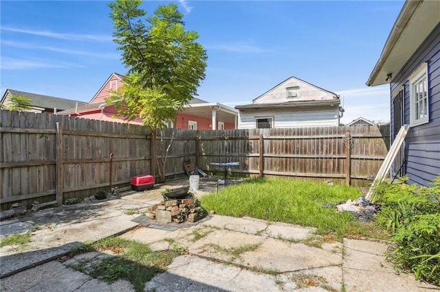 133234 Port St, New Orleans, LA 70117 - view of yard featuring a fenced backyard and a patio area