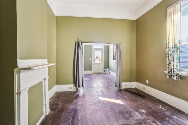 133234 Port St, New Orleans, LA 70117 - unfurnished living room featuring hardwood / wood-style floors and baseboards