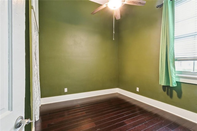 2725 Philip St, New Orleans, LA 70113 - spare room with ceiling fan, baseboards, and dark wood-type flooring