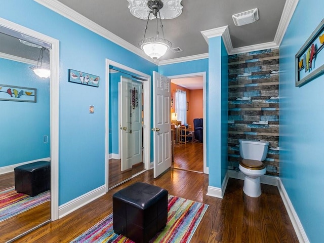 18 Curtis Dr, New Orleans, LA 70126 - hallway with baseboards, ornamental molding, visible vents, and wood finished floors