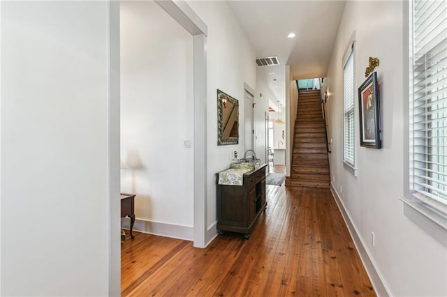 125 Elmira Ave, New Orleans, LA 70114 - corridor featuring hardwood / wood-style flooring, stairway, and recessed lighting