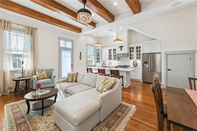 125 Elmira Ave, New Orleans, LA 70114 - living room with beam ceiling, hardwood / wood-style floors, recessed lighting, and a chandelier