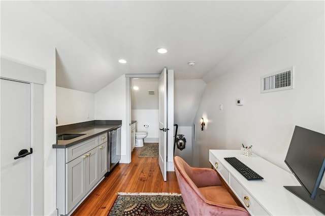 125 Elmira Ave, New Orleans, LA 70114 - full bathroom with beverage cooler, vaulted ceiling, wood finished floors, and recessed lighting