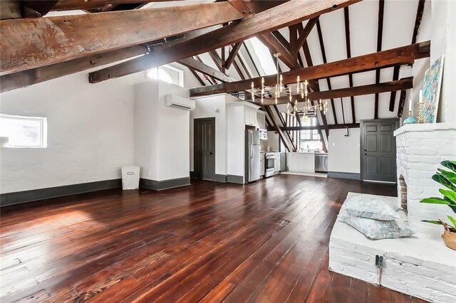 516 Governor Nicholls St Unit 401, New Orleans, LA 70116 - unfurnished living room with dark wood-style flooring, a notable chandelier, beam ceiling, an AC wall unit, and baseboards