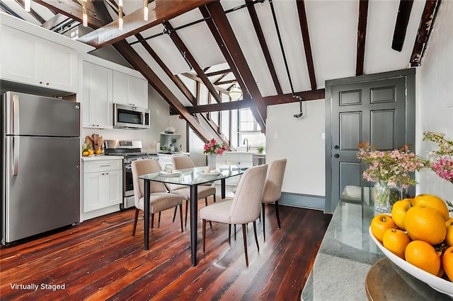 516 Governor Nicholls St Unit 401, New Orleans, LA 70116 - dining space with dark wood-type flooring, stairs, beam ceiling, and high vaulted ceiling