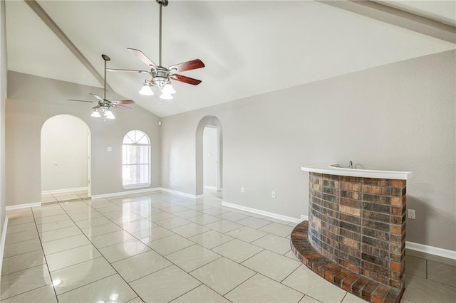 3800 Decomine Dr, Chalmette, LA 70043 - spare room with light tile patterned flooring, baseboards, a ceiling fan, arched walkways, and vaulted ceiling