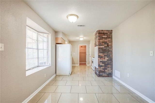 3800 Decomine Dr, Chalmette, LA 70043 - empty room with baseboards, visible vents, and light tile patterned floors