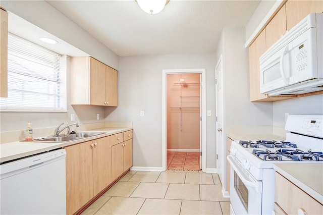 3800 Decomine Dr, Chalmette, LA 70043 - kitchen featuring light tile patterned flooring, light countertops, a sink, light brown cabinets, and white appliances