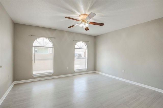 3800 Decomine Dr, Chalmette, LA 70043 - empty room featuring baseboards, ceiling fan, and a textured ceiling