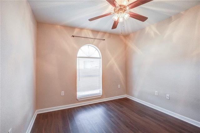 3800 Decomine Dr, Chalmette, LA 70043 - unfurnished room with dark wood-style floors, baseboards, and ceiling fan