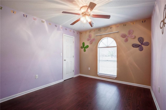 3800 Decomine Dr, Chalmette, LA 70043 - spare room featuring baseboards, ceiling fan, and wood finished floors